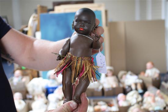 An AM 351 black baby, jointed body, 8in., a Heubach black doll, 9in., paint loss on neck and a Heubach black baby, 6in. (3)